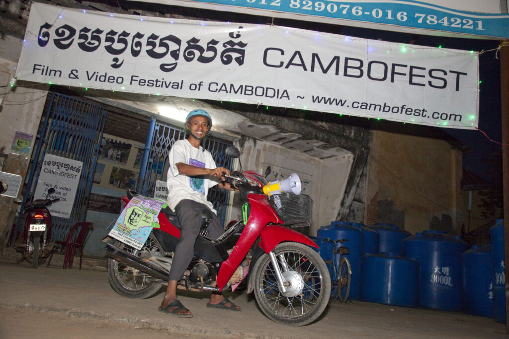 Cambodia's 1st International Film Festival, CamboFest | In front of the old Royal cinema with staffer Narith Hoo.